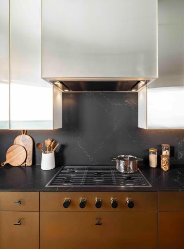 Modern Urban finish palette includes Cambria waterfall countertop, walnut wide plank flooring & trim. Photos courtesy of Cambria.