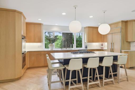 The center island is the ideal spot for casual meals or for sipping your morning coffee. Use as additional workspace for meal prep, or set up a buffet here.