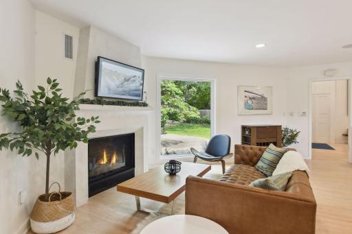 Bask in the warmth of the fireplace while taking in the peaceful outdoor views.