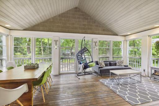 Find vaulted ceilings, wood flooring, and windows on 3 sides.
