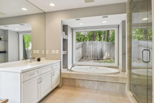 Soothe away your stress in the jetted tub. There is also a separate shower with tiled accents.