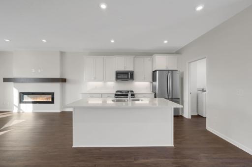 The kitchen has Silestone quartz countertops and stainless steel appliances included.