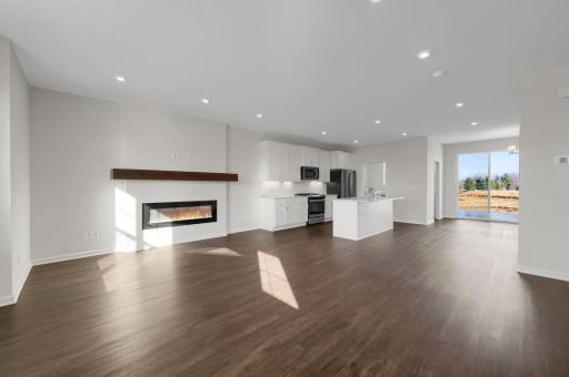 The family room has a designer electric fireplace. LVP flooring throughout the main level.