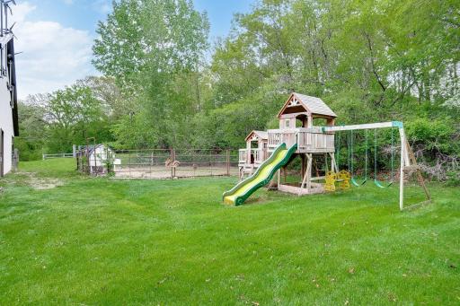 side yard between barn and pool riding ring