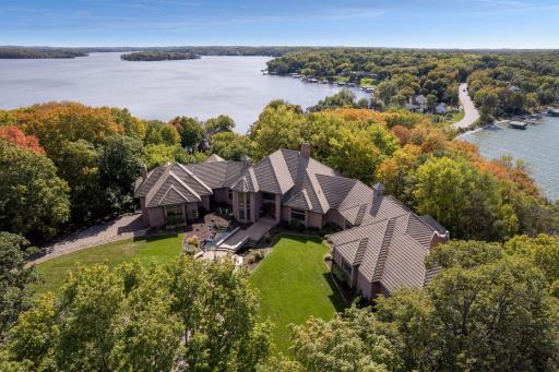 Introducing 5750 Hardscrabble Circle in beautiful Minnetrista. Nestled on 5.77 acres along the shores of Lake Minnetonka, this landmark property boasts seven bedrooms, nine bathrooms and five fireplaces across 13,980 finished square feet.