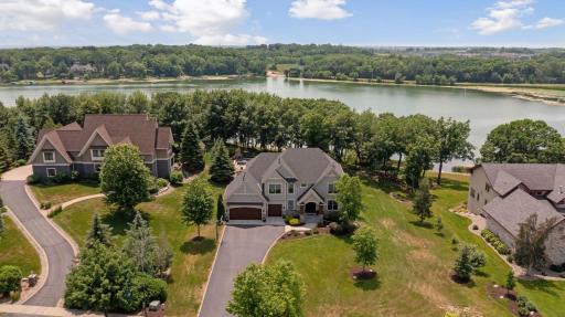 Welcome to 3613 LeRive Way on nearly 1.50 acre. Lush landscaping, apple trees, ideal green space and more on this quiet street to enjoy lakeshore living with nearly 200 feet of hard sand lakefront.