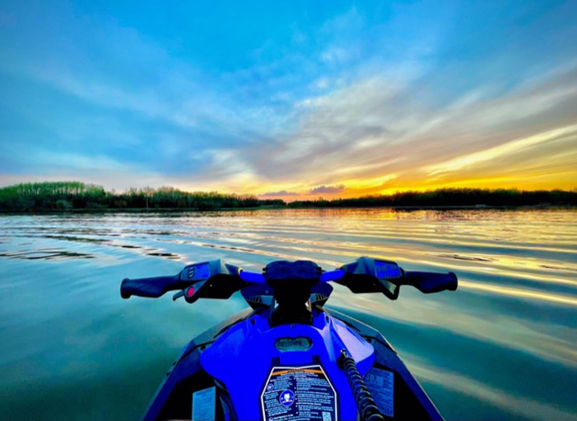 Night on the lake by seller on his Jet Ski enjoying the cool sky. A must see lake home /200 ft hard sand lakefront - 3613 LeRive Way - Custom built home with primary suite on the main level.