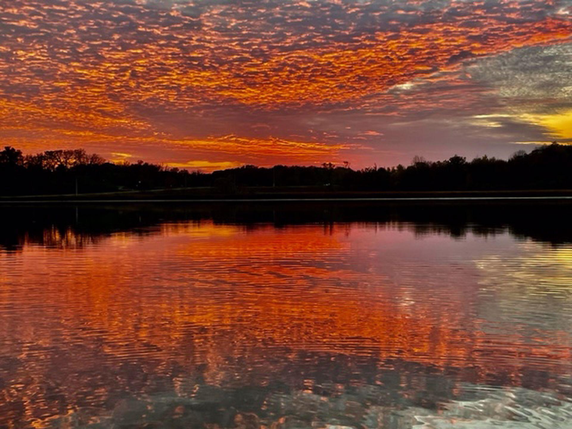 Jaw dropping sunset photo from sellers sitting on their dock with friends.
