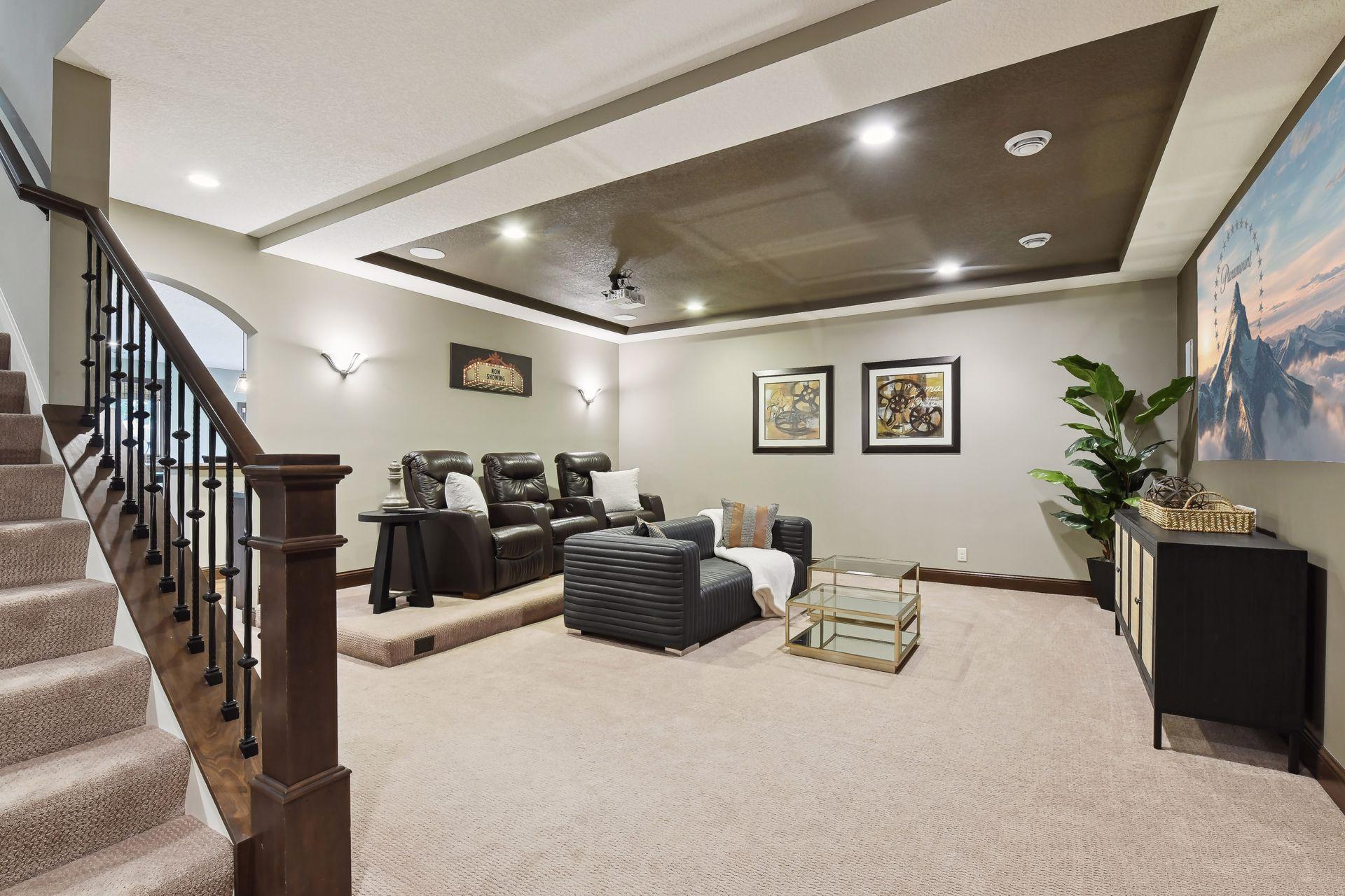 Great spot to watch a movie for many kids or adults in this open spacious theater area. Projector overhead with wall screen.