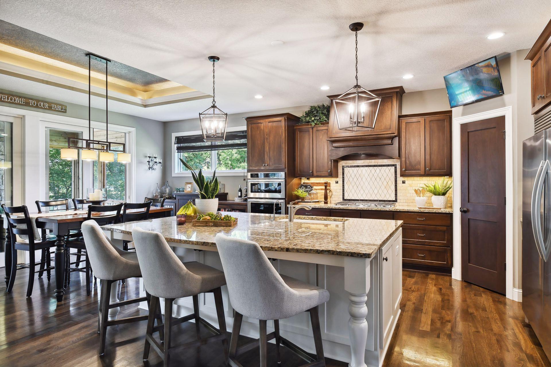 Beautiful kitchen with custom cabinetry and center island ideal for entertaining family or guests.
