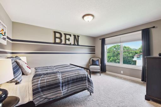 Second upper bedroom with views of lake and large walk in closet.