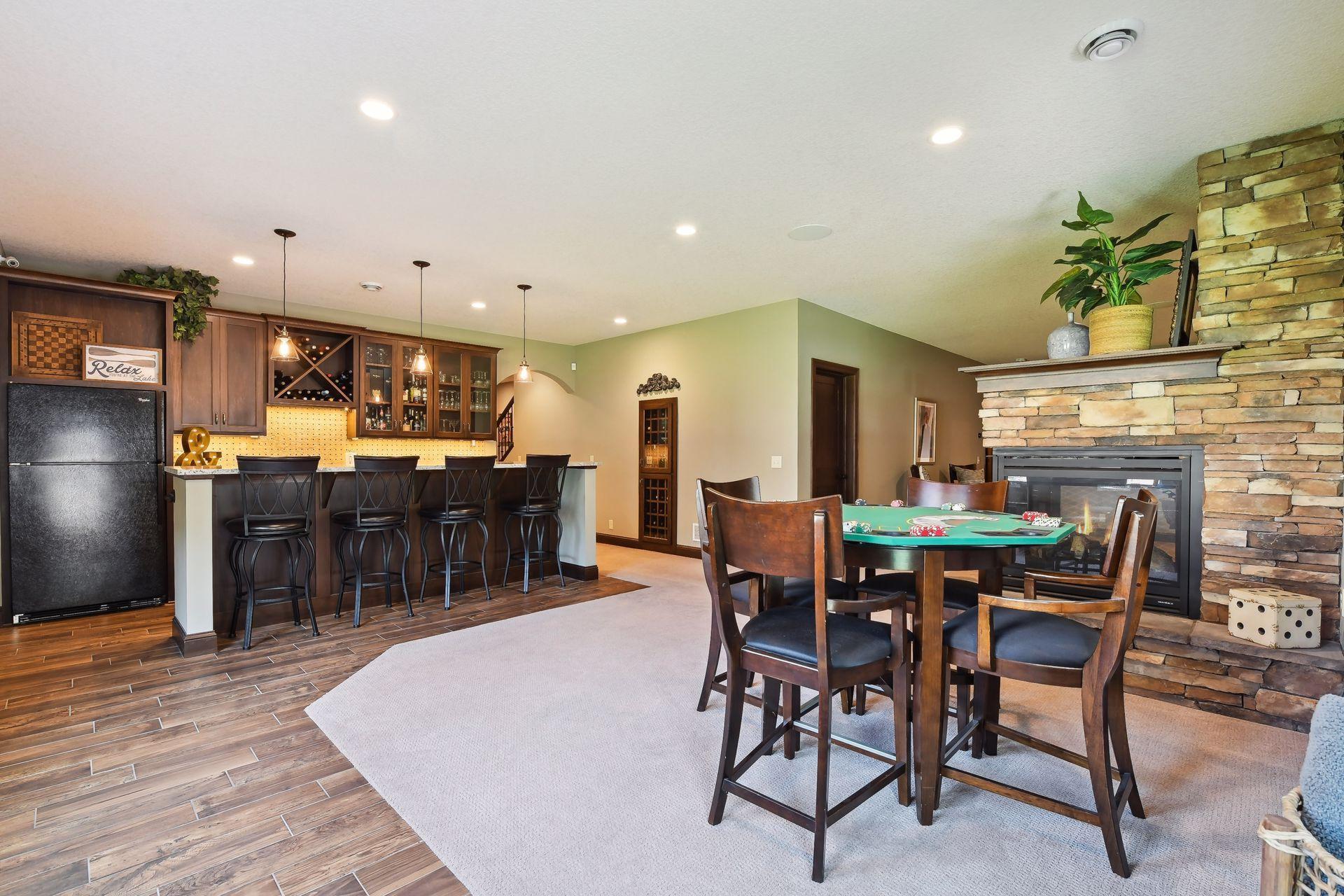 Gaming area to play cards next to double sided fireplace.