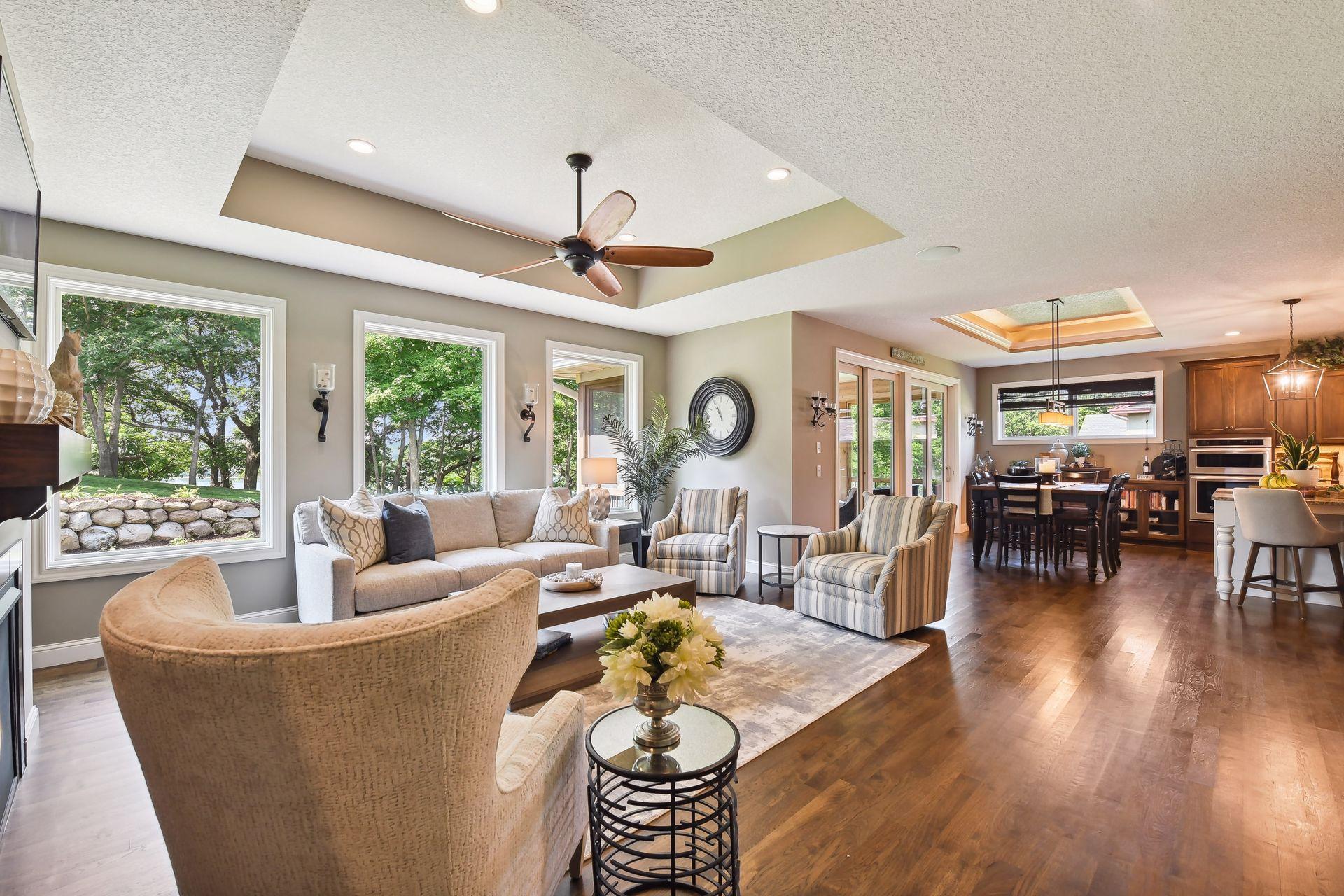 View from corner before entering ML primary bedroom. Open family room to kitchen and wall of windows to the backyard.
