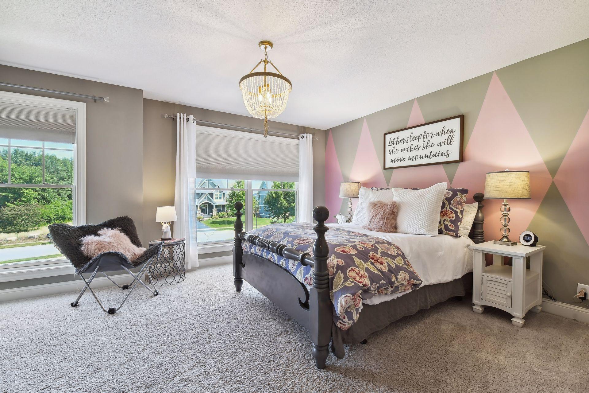 Full suite bedroom with bathroom with views towards the front yard. Nice walk in closet with built-ins.