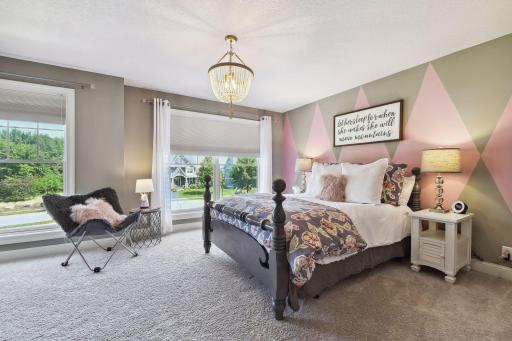 Full suite bedroom with bathroom with views towards the front yard. Nice walk in closet with built-ins.