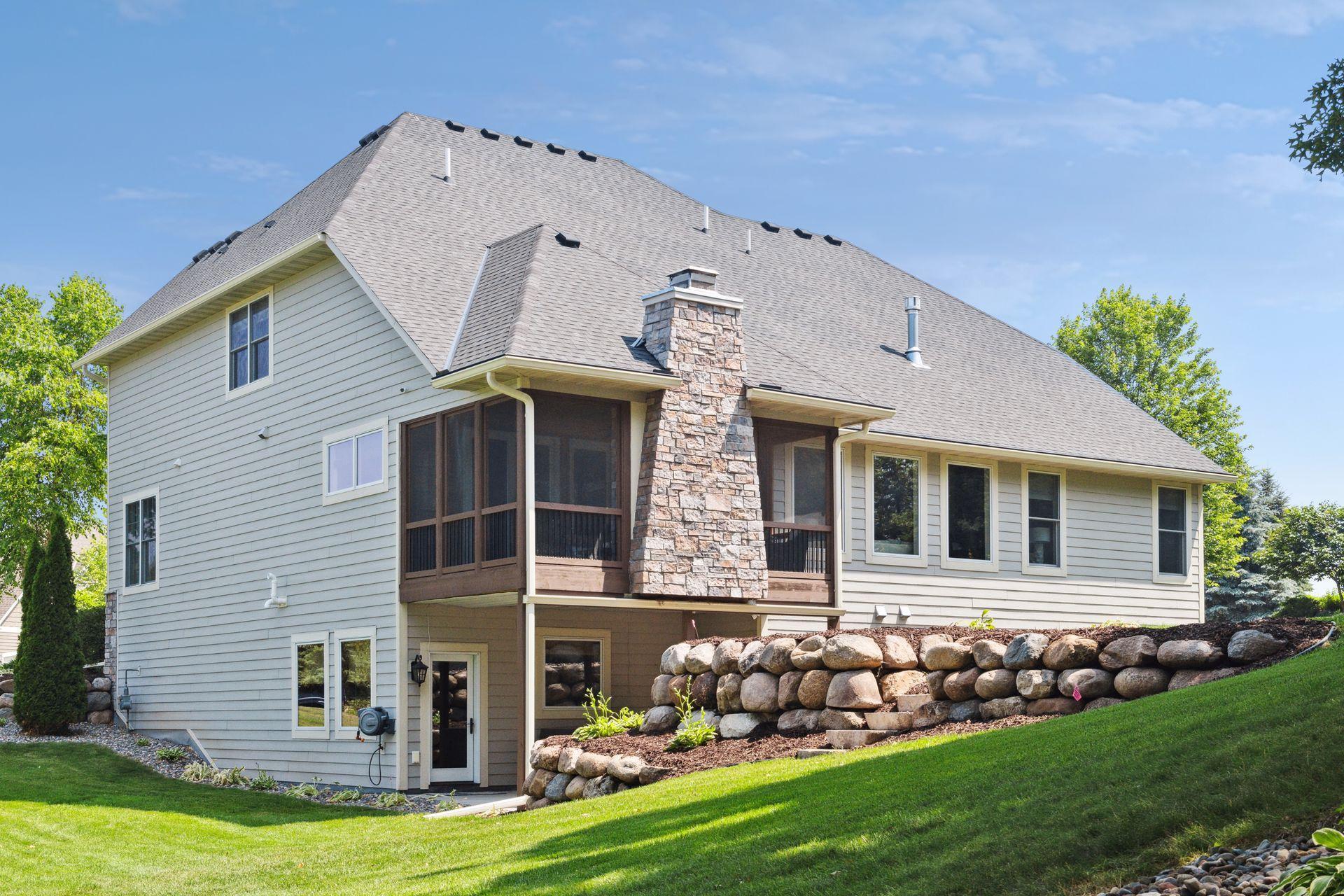 Back of home from private lake path on this home site. Backyard can accommodate a pool if so desired.