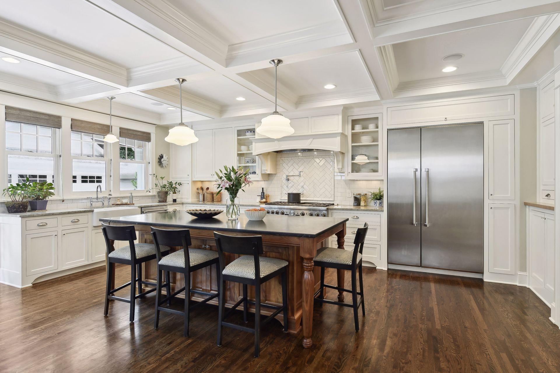 Gourmet kitchen with coffered ceilings and quality appliances