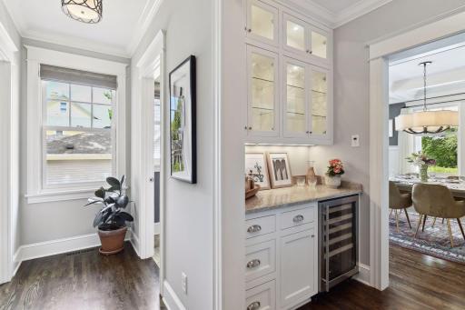 Butler's pantry with additional fridge and glass display shelves