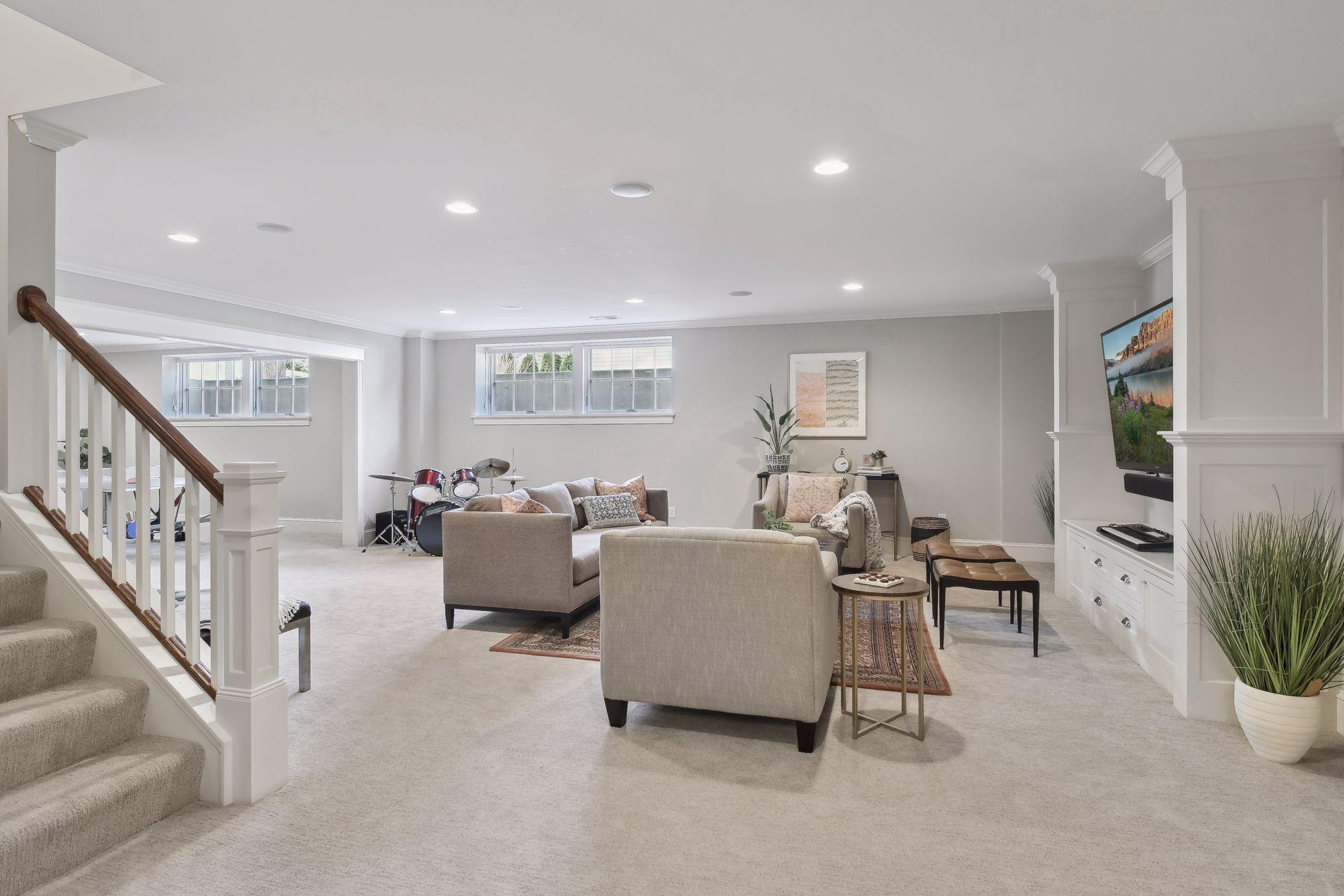 Lower level family room with high ceilings and daylight windows