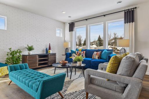 You will love the natural light that fills this open concept space! This picture is from the model home.