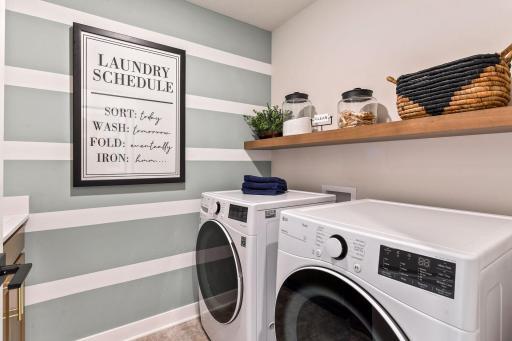 A large laundry room is conveniently located on the second floor. No more stairs for you! This picture is from the model home.