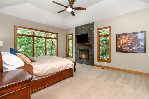 Main Level Master bedroom with cozy fireplace to get away from every day life