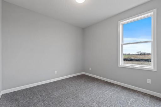 *Model Home - finishes may vary* Each of the home's secondary bedrooms on the upper level come perfectly sized and all feature a spacious closet.