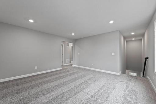 *Model Home - finishes may vary* This spacious loft is right off of the stairs and is the perfect space for kids to play!