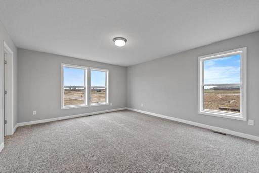 *Model Home - finishes may vary* Each of the home's secondary bedrooms on the upper level come perfectly sized and all feature a spacious closet.