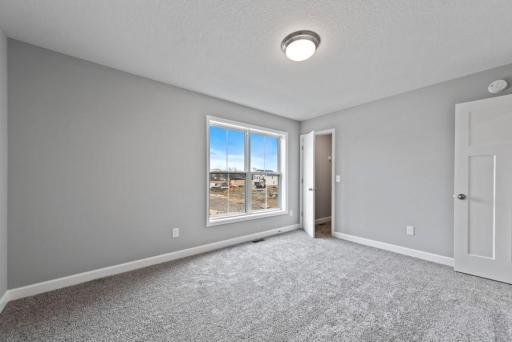 *Model Home - finishes may vary* Each of the home's secondary bedrooms on the upper level come perfectly sized and all feature a spacious closet.