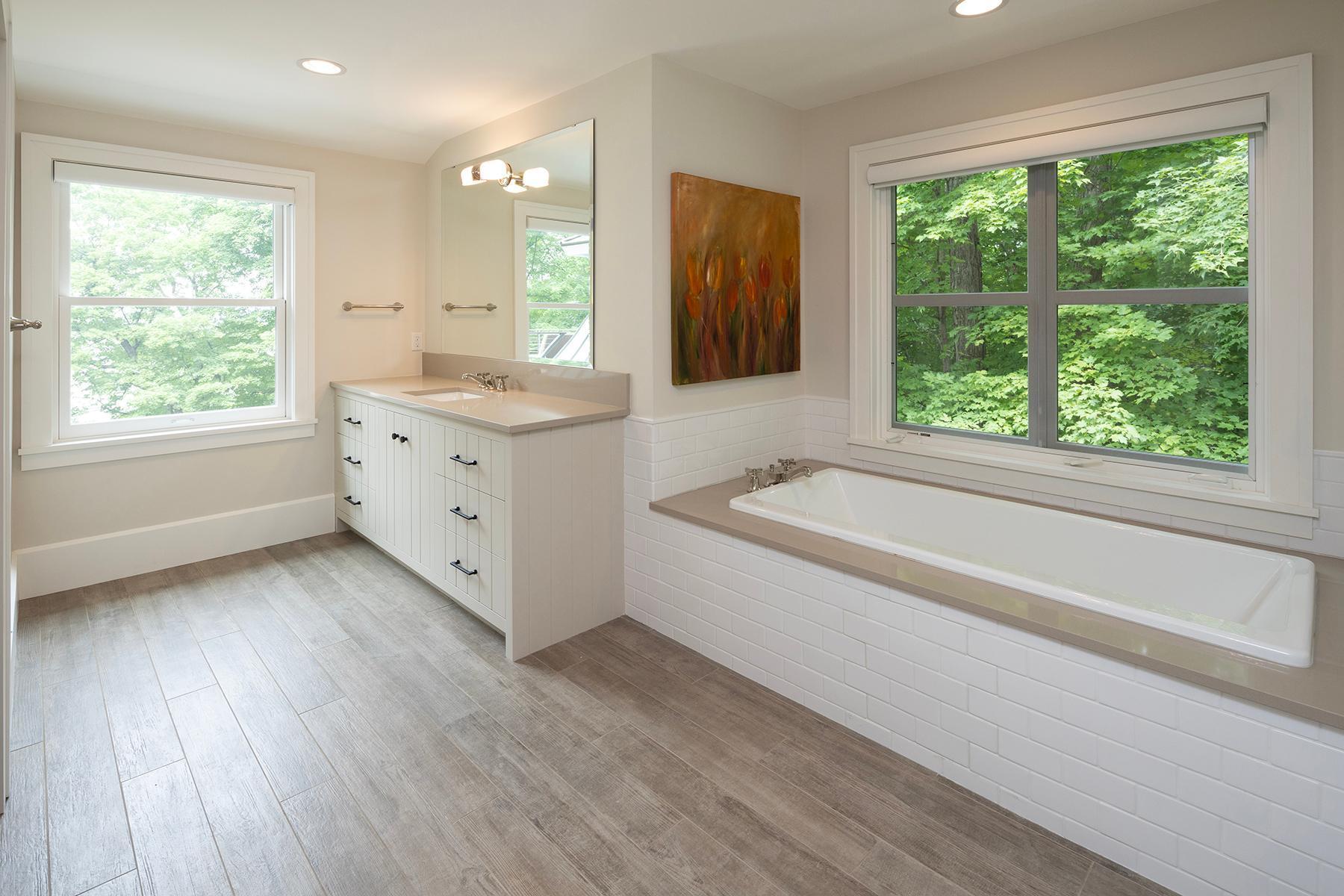 Large private bathroom with soaking tub and walk-in shower