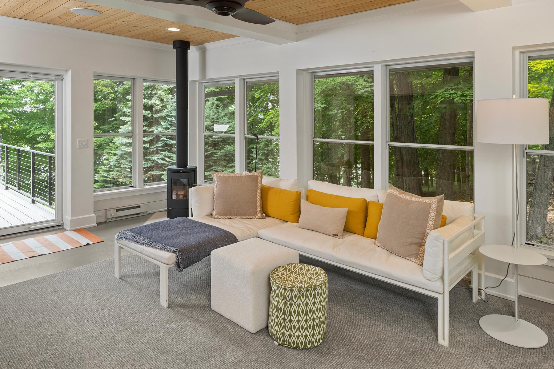 Cozy finished porch with woodstove for those chilly nights