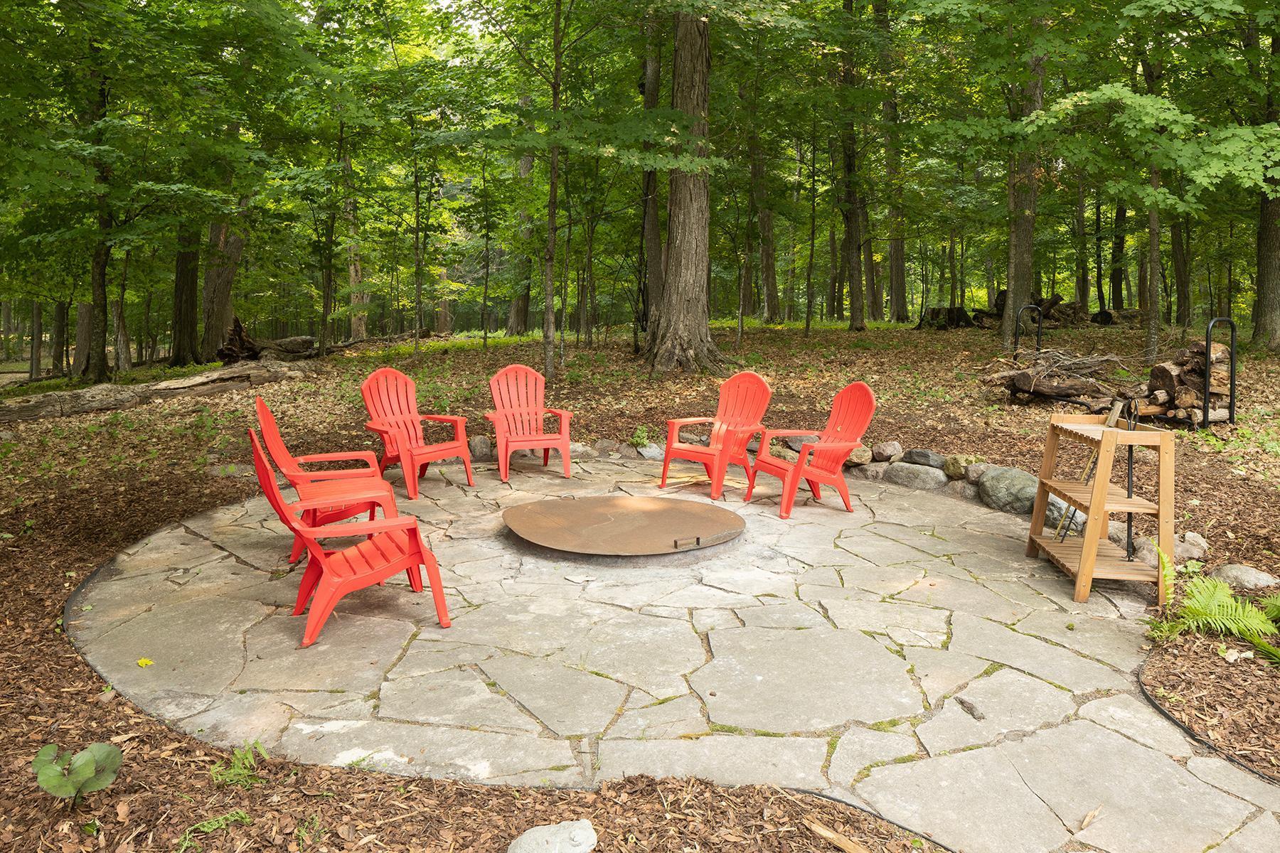 Wooded patio with firepit