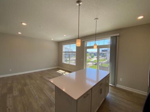 Sunlit kitchen with dining space which can also be a family room.