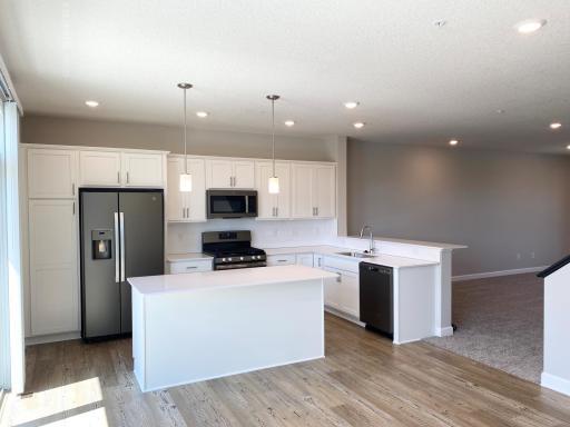 Spacious kitchen with plenty of cabinet space and open floorplan.