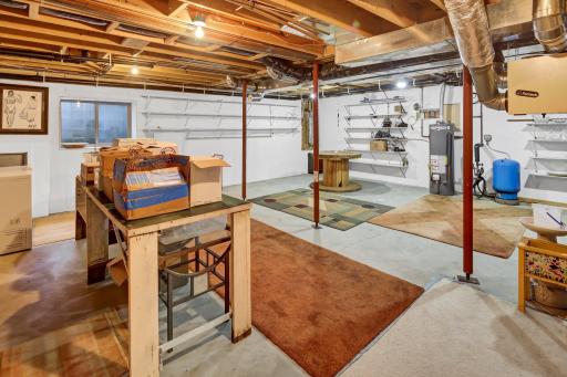Unfinished lower level space lends room for a 4th bedroom