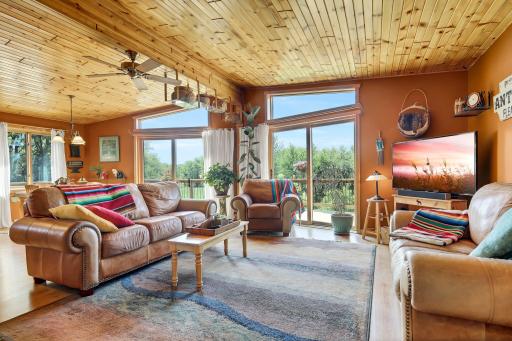 Elongated windows throughout the living room and kitchen allowing tons of natural light through.