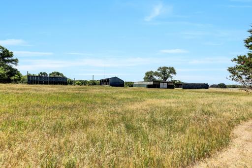 Horse arena, pasture, hay shed, and stalls. Hay shed is 17 x 90, Horse Arena is 50 x 90, Machine shed is 84 x 24.