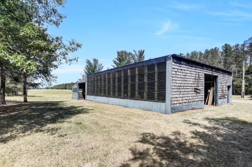 What was considered the barn- is now used mostly as an oversized garage. Steel framed ceiling construction