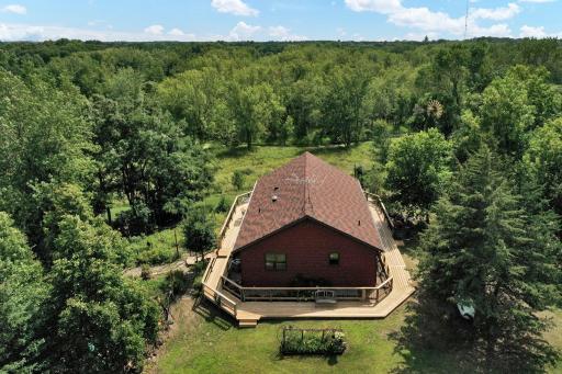 Over head view looking east- notice the walk around deck surrounds the entire home