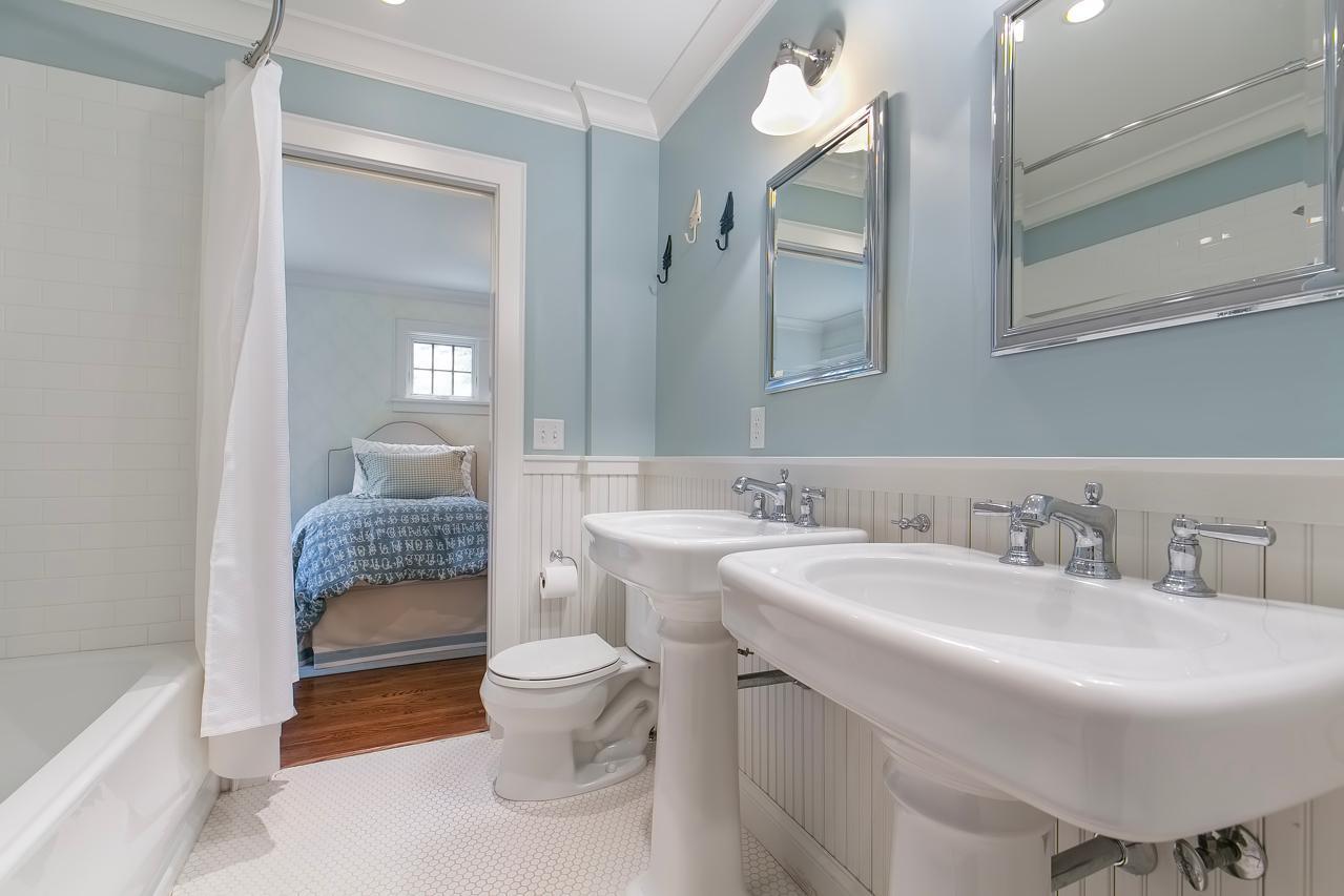 Full bath with penny tile and subway