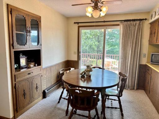 Dining room w/ built-in hutch & patio doors that bring you to the deck