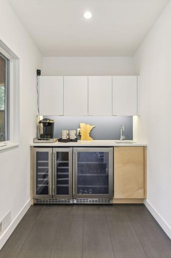 Wet bar with dual beverage and wine bar .