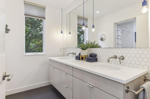 The smart two room design of the upper level full bathroom.