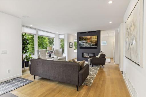 Light filled living room with beautiful matte finish white oak floors.