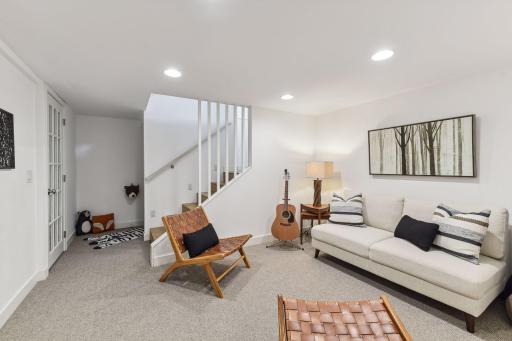 Another view of the lower level family room with the cozy under stairway nook.