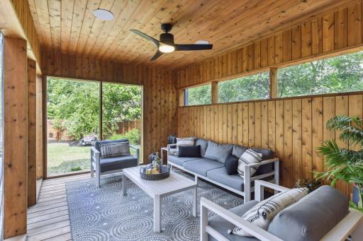 Beautiful screen porch overlooking the private backyard