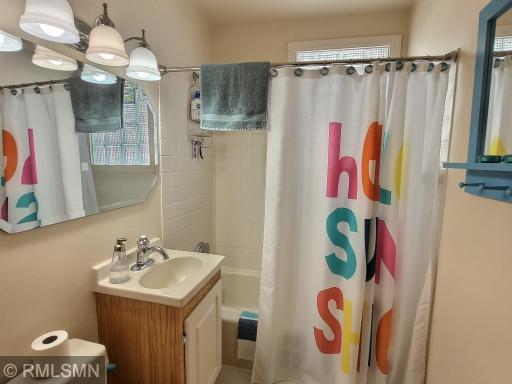 View of the full bathroom situated next to both of the main level bedrooms.