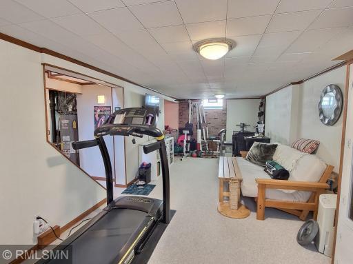 The family room extends into another storage area, or use of your choice. Laundry room and utilities are to the left of the bottom of the staircase.