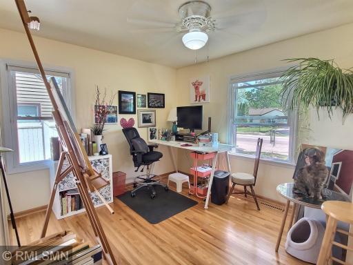 The first bedroom - or office space if you choose! Wood flooring, closet, ceiling fan, and measures roughly 12x13.